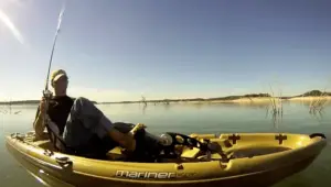 a man in a fishing pedal kayak