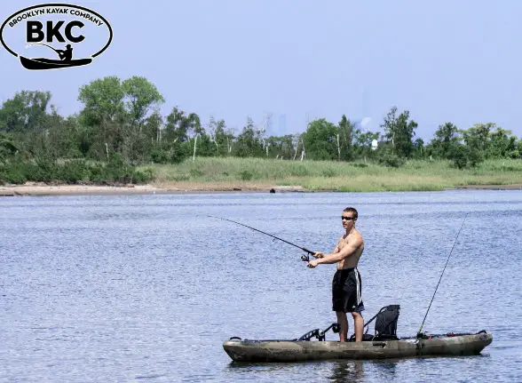 man fishing on pedal kayak