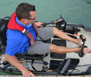 man pedaling kayak