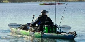 man fishing on lake