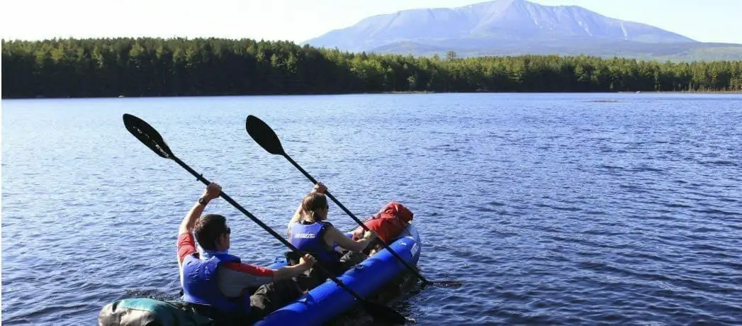 two people in a sea eagle kayak