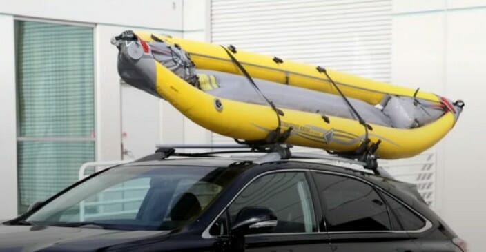 kayak at the top of the car