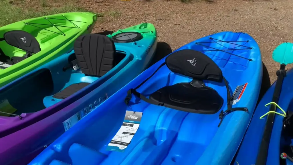 kayaks in blue, green and purple colors